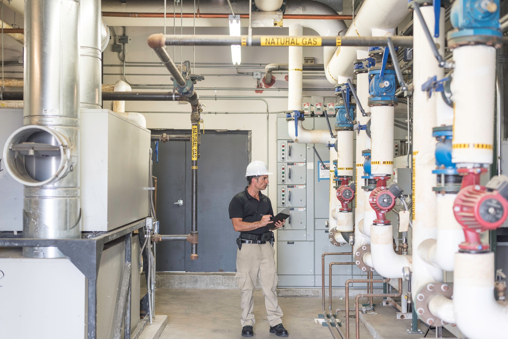Hvac tech full body in boiler room
